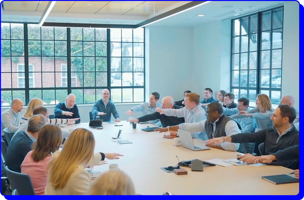 Gridiron Capital team meeting in a bright office
